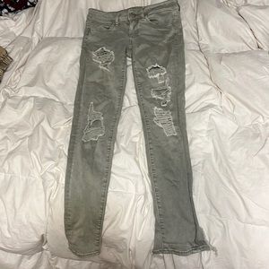 size 4 light olive green ripped jeans from american eagle